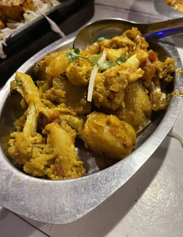 Potatoes and cauliflower in a steel dish