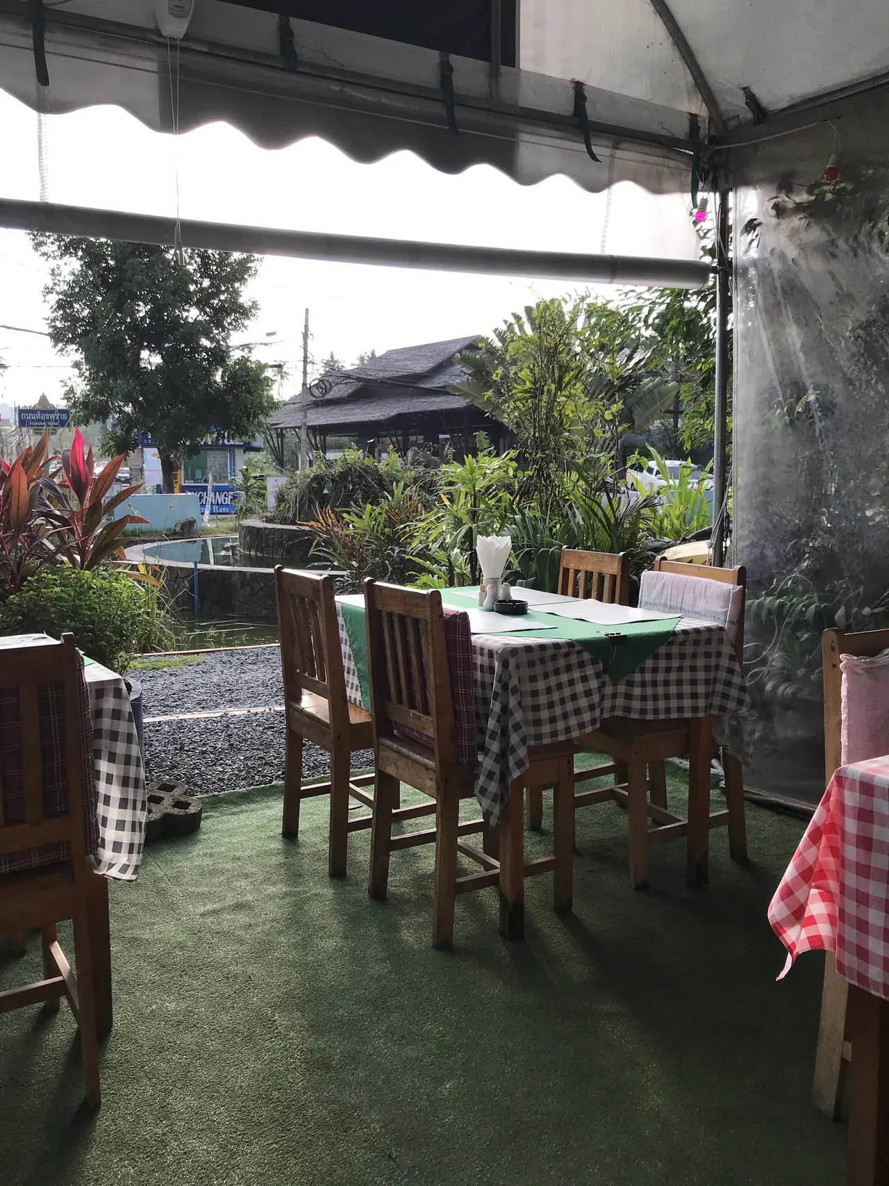 A table under the awning, looking out over the garden